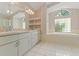 Bathroom with double vanity, soaking tub, and walk-in shower at 1379 Matthew Ave, Spring Hill, FL 34609