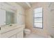 Cozy bathroom featuring a single vanity, toilet, and shower at 1379 Matthew Ave, Spring Hill, FL 34609