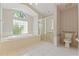 Bathroom featuring a soaking tub, walk-in shower and decorative wallpaper at 1379 Matthew Ave, Spring Hill, FL 34609