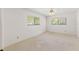 A bright bedroom featuring neutral walls and large windows at 1379 Matthew Ave, Spring Hill, FL 34609