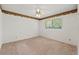 A bedroom featuring neutral walls and a window at 1379 Matthew Ave, Spring Hill, FL 34609