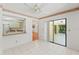 Eat-in kitchen area featuring tiled floors and sliding glass door leading to outdoor spaces at 1379 Matthew Ave, Spring Hill, FL 34609