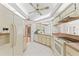 Cozy kitchen features tiled floors, white appliances, and an eat-in area at 1379 Matthew Ave, Spring Hill, FL 34609