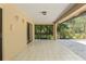 Spacious covered lanai with tile flooring, screened windows and natural light perfect for outdoor entertaining at 1379 Matthew Ave, Spring Hill, FL 34609