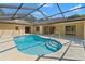 Beautiful screened-in pool area that leads to a large lanai, perfect for entertaining at 1379 Matthew Ave, Spring Hill, FL 34609
