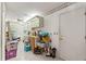 A cluttered room with tile flooring and plenty of storage at 1379 Matthew Ave, Spring Hill, FL 34609