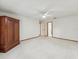 Bedroom featuring a ceiling fan, wooden armoire and carpeted flooring at 1414 Stephens Oak Ct, Plant City, FL 33567