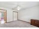 Bedroom with neutral carpet, closet, and dresser; access to other rooms at 1414 Stephens Oak Ct, Plant City, FL 33567