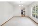 Bright dining area with carpet, natural light, and view of the kitchen at 1414 Stephens Oak Ct, Plant City, FL 33567