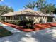 A home's well-kept exterior with manicured landscaping, decorative rock and a sidewalk at 1414 Stephens Oak Ct, Plant City, FL 33567