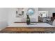 Close up on the dining room table with a wood table and woven table runner at 1432 S Keene Rd, Clearwater, FL 33756