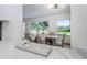 View from kitchen to dining room with modern decor, table set for dinner, and stylish lighting at 1432 S Keene Rd, Clearwater, FL 33756