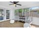 Inviting Florida room with comfortable seating, neutral tones, and plenty of natural light, perfect for relaxing and entertaining at 1432 S Keene Rd, Clearwater, FL 33756