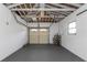 Spacious garage features an open ceiling and door with windows offering potential for storage or workspace at 1432 S Keene Rd, Clearwater, FL 33756