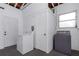 Laundry room has a washer, dryer and storage space that adds convenience to daily chores at 1432 S Keene Rd, Clearwater, FL 33756