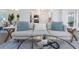 Living room view to bright kitchen and dining room with open floor plan, a couch, and stylish decor at 1432 S Keene Rd, Clearwater, FL 33756