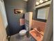 Charming bathroom with unique pink tiled sink and wall and matching wall cabinet at 1542 Sherwood St, Clearwater, FL 33755