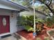 Close up of front door and tropical landscaping at 1542 Sherwood St, Clearwater, FL 33755