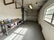 Spacious garage features a workbench, overhead lighting, and ample storage space for projects and vehicles at 1542 Sherwood St, Clearwater, FL 33755