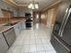 Bright kitchen with stainless steel appliances, tile floors, and lots of counter space at 1542 Sherwood St, Clearwater, FL 33755