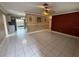 Open living room with tiled flooring and sliding glass doors to the outside at 1542 Sherwood St, Clearwater, FL 33755