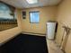 Well-lit utility room features a modern water heater and dedicated space for appliances and storage at 1542 Sherwood St, Clearwater, FL 33755
