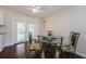 Dining Area with decorative chairs and glass table near the French Doors at 1615 Stonehaven Way, Tarpon Springs, FL 34689