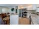 Kitchen with stainless steel appliances and granite countertops at 1615 Stonehaven Way, Tarpon Springs, FL 34689