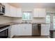 Kitchen with granite countertops and stainless steel appliances at 1615 Stonehaven Way, Tarpon Springs, FL 34689
