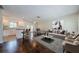 Open-concept living space with modern decor, hardwood floors, and ample natural light at 1615 Stonehaven Way, Tarpon Springs, FL 34689