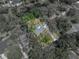 Aerial view of the home's lot lines with a pool and lush landscaping at 17515 Drake Ct, Lutz, FL 33559