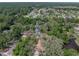 Discover the beauty of this home's aerial view, featuring a pool and verdant landscape at 17515 Drake Ct, Lutz, FL 33559
