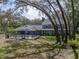 Aerial view showcases home with screened pool, perfect outdoor space, and natural landscape at 17515 Drake Ct, Lutz, FL 33559
