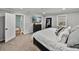 Bedroom with a large window, soft carpet, and a view into the walk-in closet at 17515 Drake Ct, Lutz, FL 33559