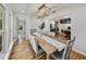 Formal dining room with a large wooden table and open access to the kitchen at 17515 Drake Ct, Lutz, FL 33559