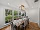 Dining room with natural light, a wooden table and seating for six at 17515 Drake Ct, Lutz, FL 33559