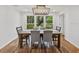 Formal dining room with a large wooden table, seating for six, and natural light at 17515 Drake Ct, Lutz, FL 33559
