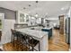 Spacious kitchen featuring a breakfast bar, pendant lights, modern appliances, and bright countertops at 17515 Drake Ct, Lutz, FL 33559