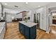 Updated kitchen with a blue island, granite countertops, and stainless steel appliances at 17515 Drake Ct, Lutz, FL 33559