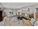Bright living room featuring hardwood floors, comfortable seating, and a view of the outdoors at 17515 Drake Ct, Lutz, FL 33559