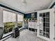 Bright office space with organized shelving and a large window looking to the outdoors at 17515 Drake Ct, Lutz, FL 33559