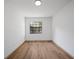 Bright bedroom features laminate flooring and a window providing natural light at 17815 Cranbrook Dr, Lutz, FL 33549