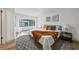 Main bedroom with lots of natural light and wood-look floors at 17815 Cranbrook Dr, Lutz, FL 33549