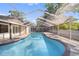 Relaxing pool view with an enclosed screen, perfect for outdoor entertaining at 17815 Cranbrook Dr, Lutz, FL 33549