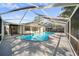 Relaxing screened-in pool area, with a clear blue pool and spacious deck perfect for entertaining at 17815 Cranbrook Dr, Lutz, FL 33549