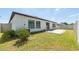 Well-maintained backyard with a paver patio and a partial view of the fenced yard at 1873 Colding Dr, Ruskin, FL 33570