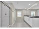 Bathroom featuring double sinks, granite counters, a glass shower and tile floors at 1873 Colding Dr, Ruskin, FL 33570