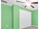 Bright green bedroom with a ceiling fan and closet at 1873 Colding Dr, Ruskin, FL 33570