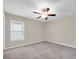 Neutral bedroom with ceiling fan and window at 1873 Colding Dr, Ruskin, FL 33570