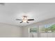 Bright bedroom with a ceiling fan and two windows providing ample natural light at 1873 Colding Dr, Ruskin, FL 33570